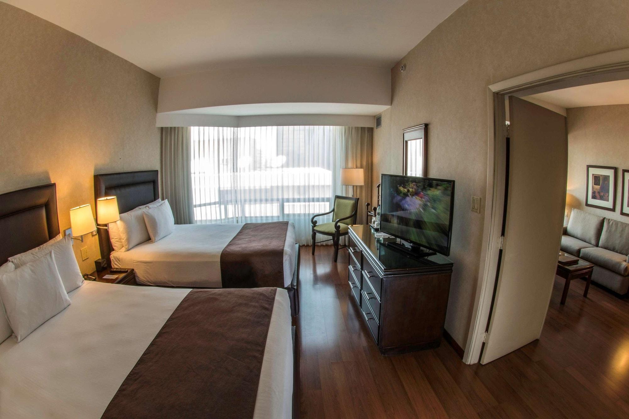 ホテル クラリオン スイーツ ガテマラ シティ グアテマラシティ エクステリア 写真 A typical hotel room
